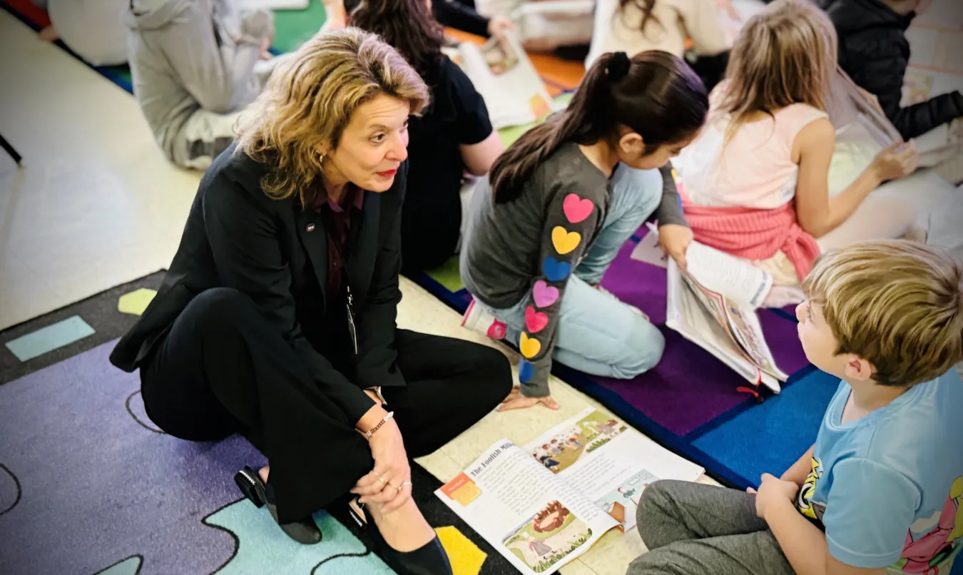 WEAC president working with young students