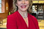 WEAC President Peggy Wirtz-Olsen standing in a school.