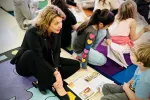 WEAC president working with young students