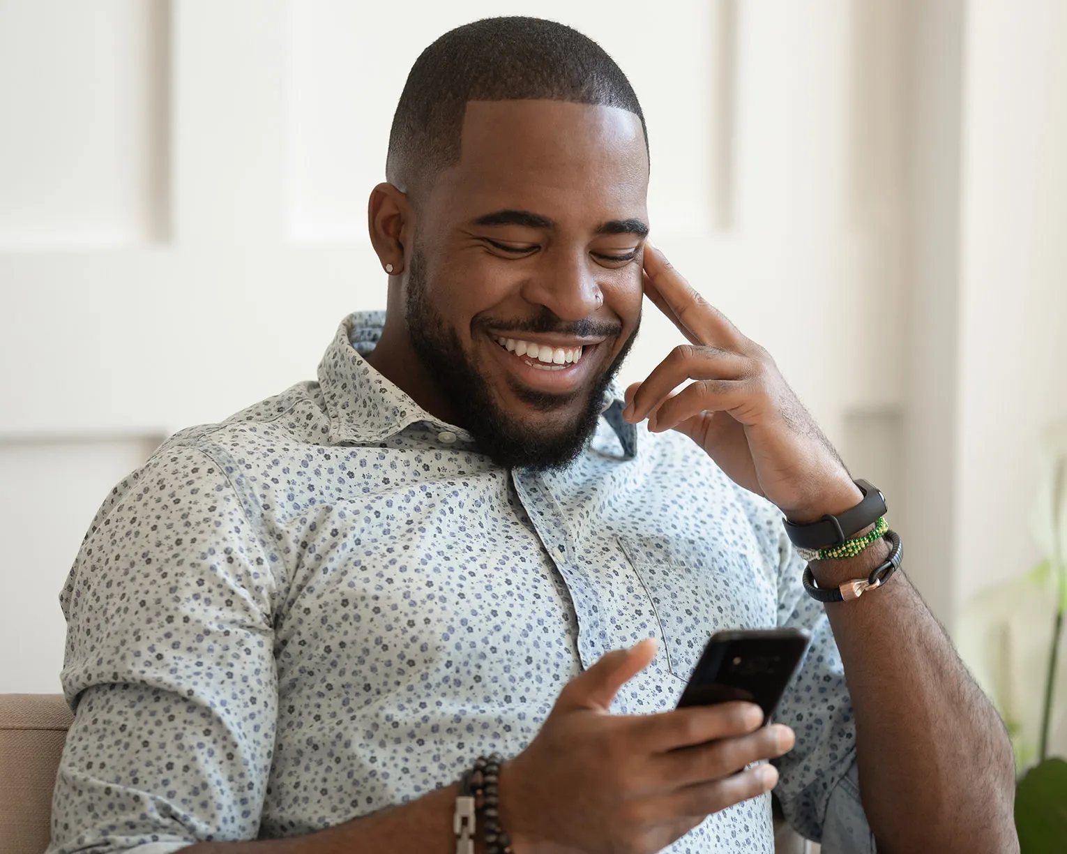 man reading news on phone