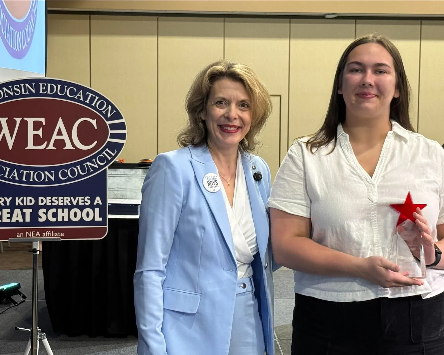 Aspiring Educators of Wisconsin member accepting award from WEAC President Peggy Wirtz-Olsen