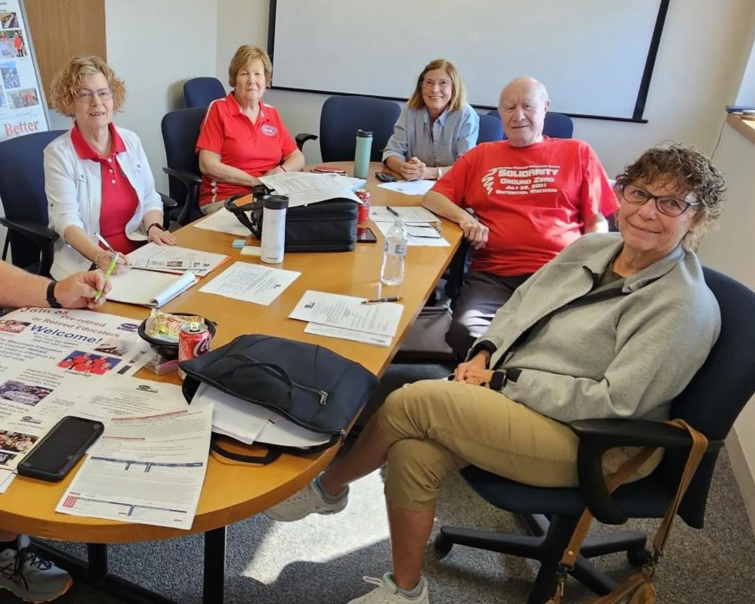 WEAC retired members working together in a conference room