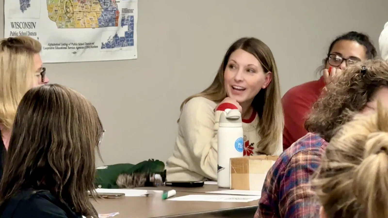 Engaged teacher interacting with colleagues