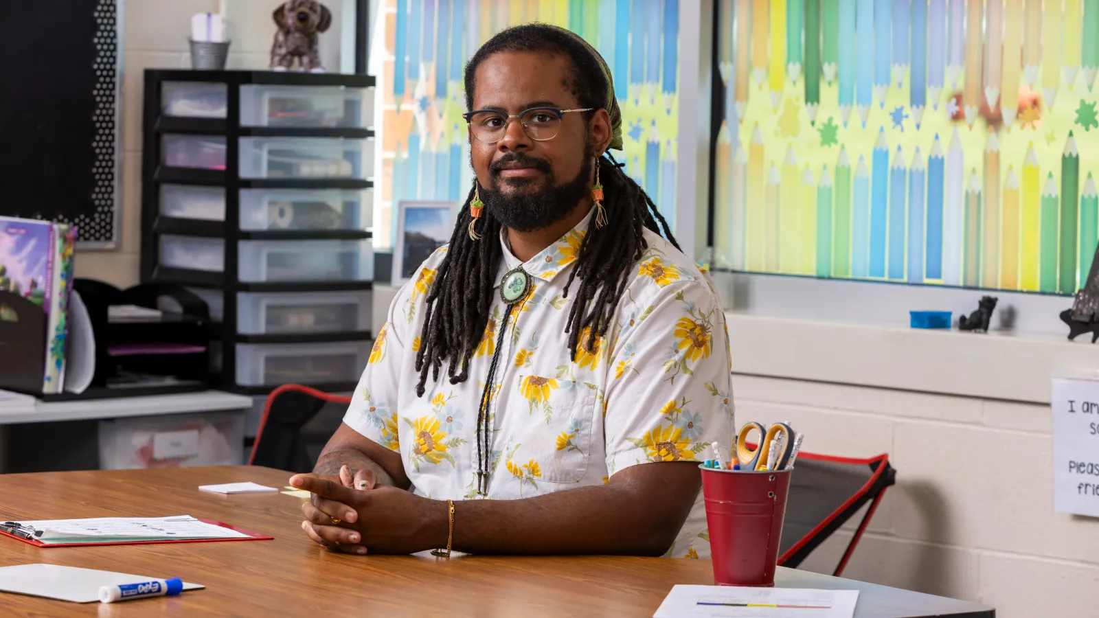 Black male teacher in classroom