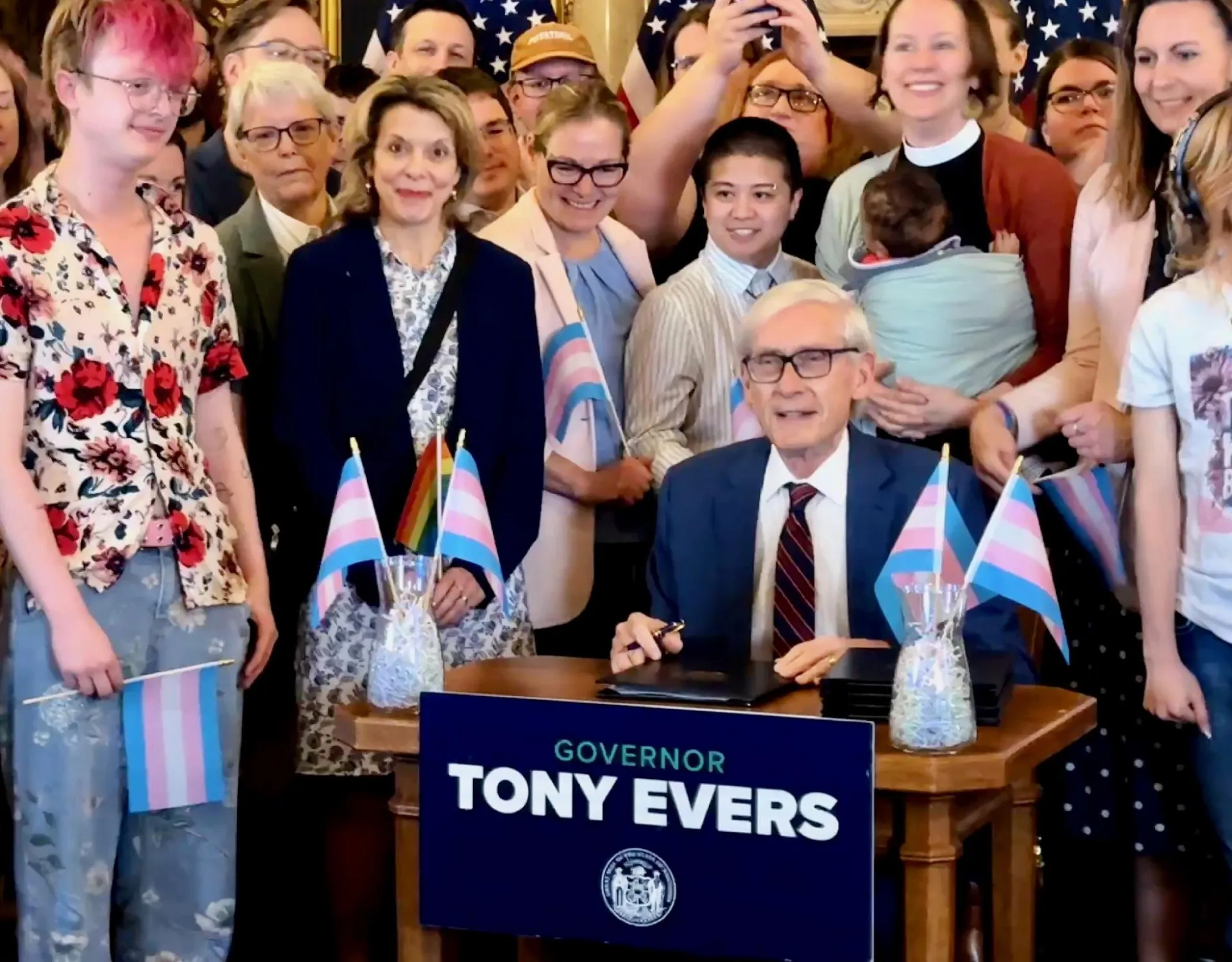 Gov. Evers and WEAC president with students at veto signing
