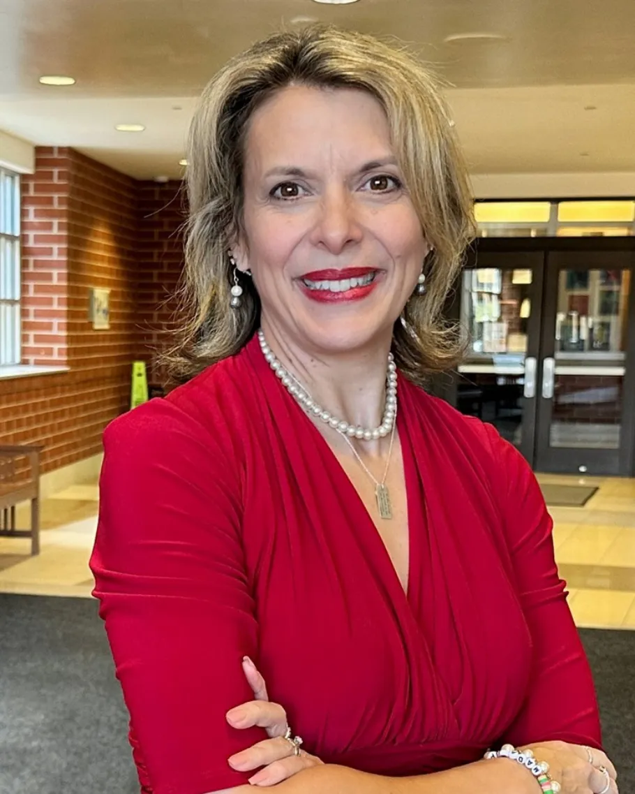 WEAC President Peggy Wirtz-Olsen standing in a school.