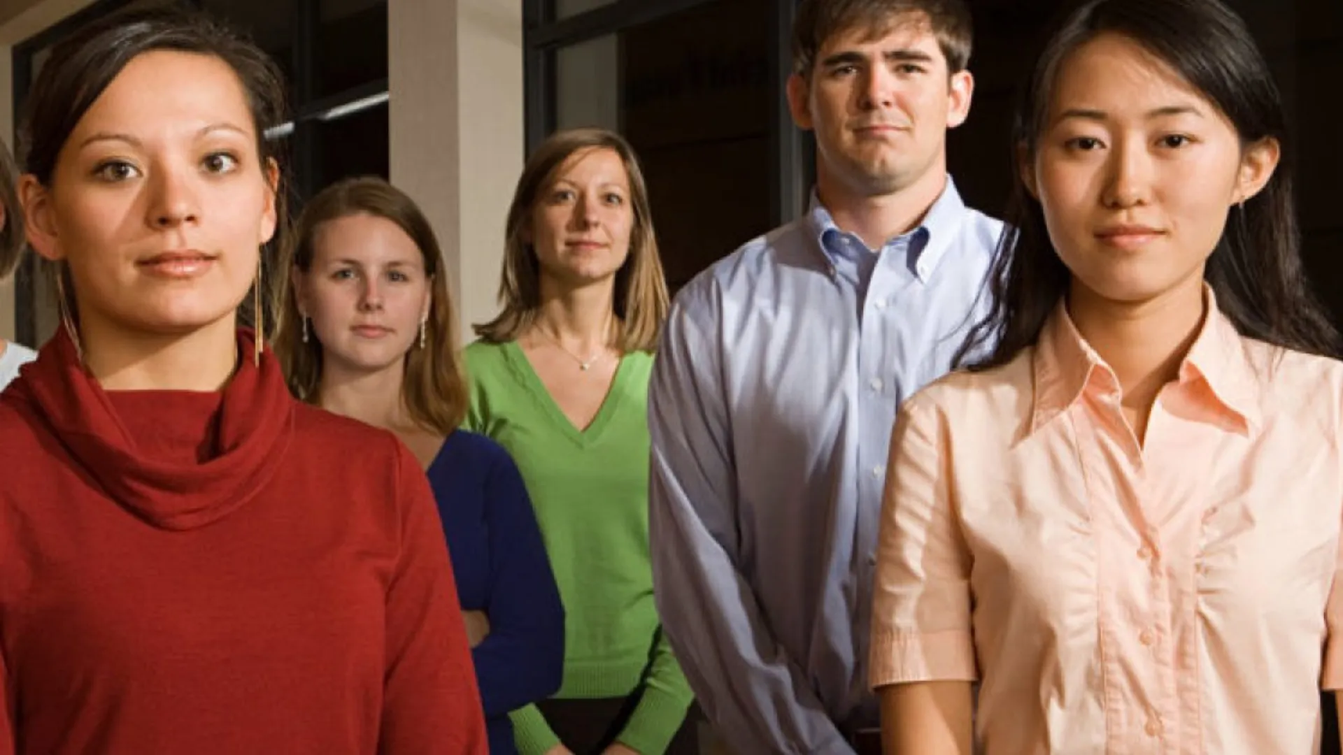 Group of five technical college students standing in a hallway