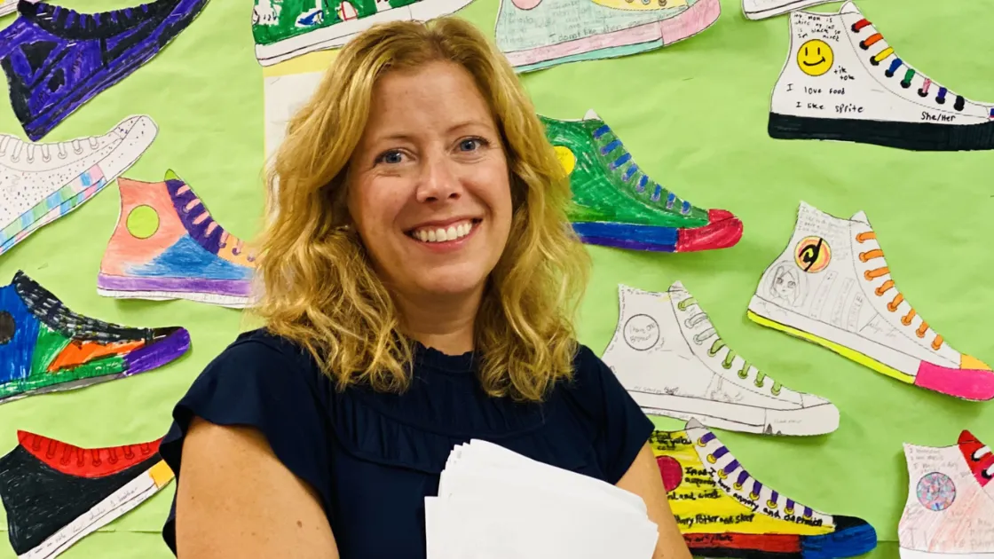 WEA Academy Instructor Patty Zemke teacher smiling in classroom.