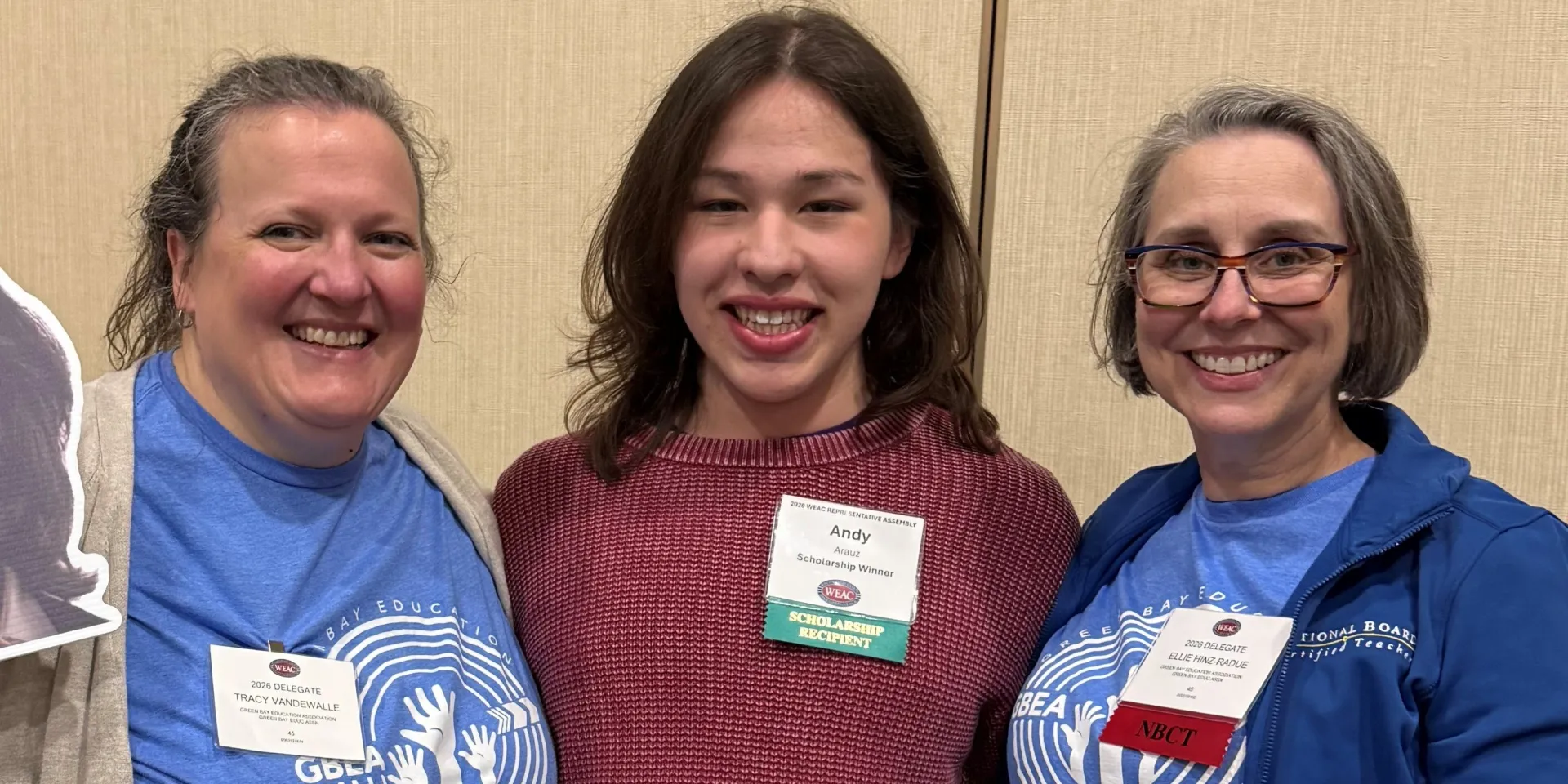 Two teachers with a scholarship recipient