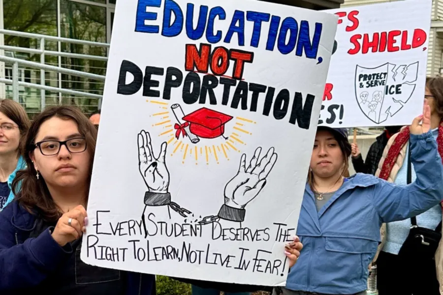 A picture of a group of middle or high school studens protesting ICE. One student holds a signt that says "Education Not Deportation."